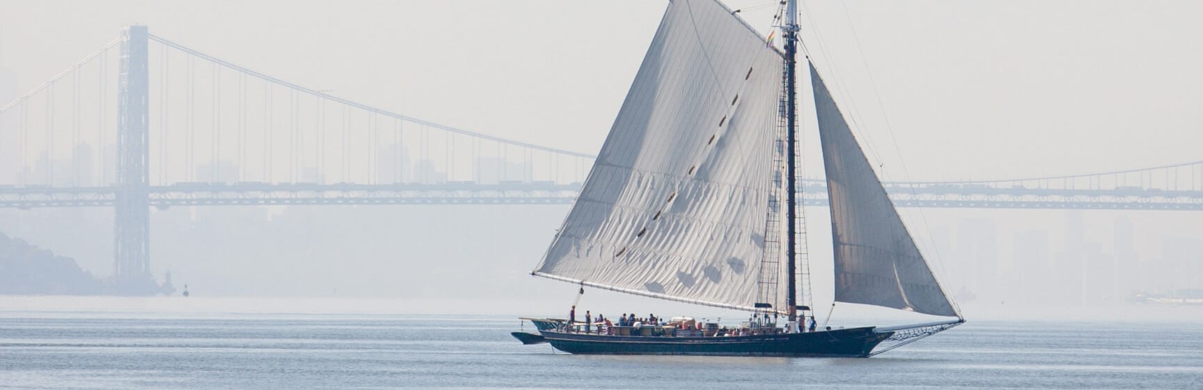 The Sloop Clearwater in front of the George Washington Bridge